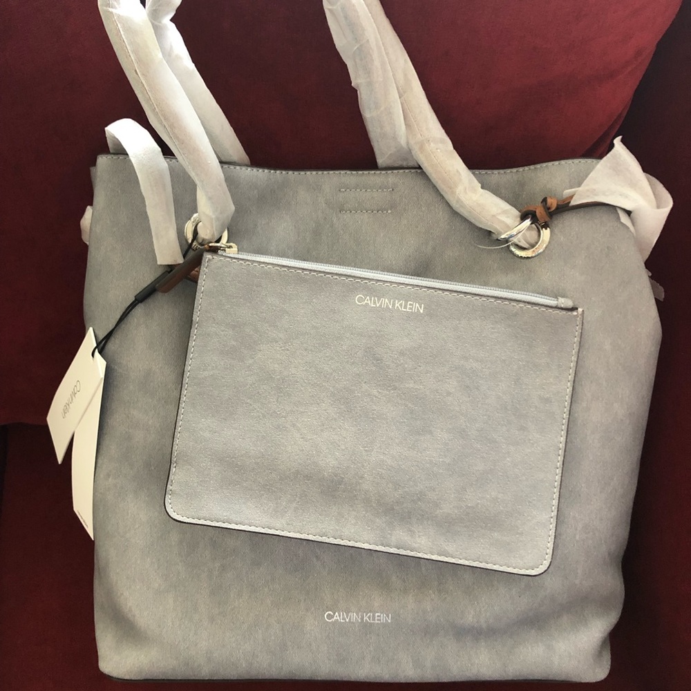 Calvin Klein reversible tote with a clutch bag.